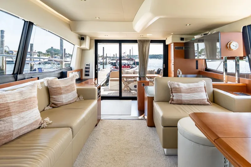 Slide: The Image of Luxurious interior of 2014 Prestige Yachts 550 Flybridge with elegant seating and scenic marina view. - 44