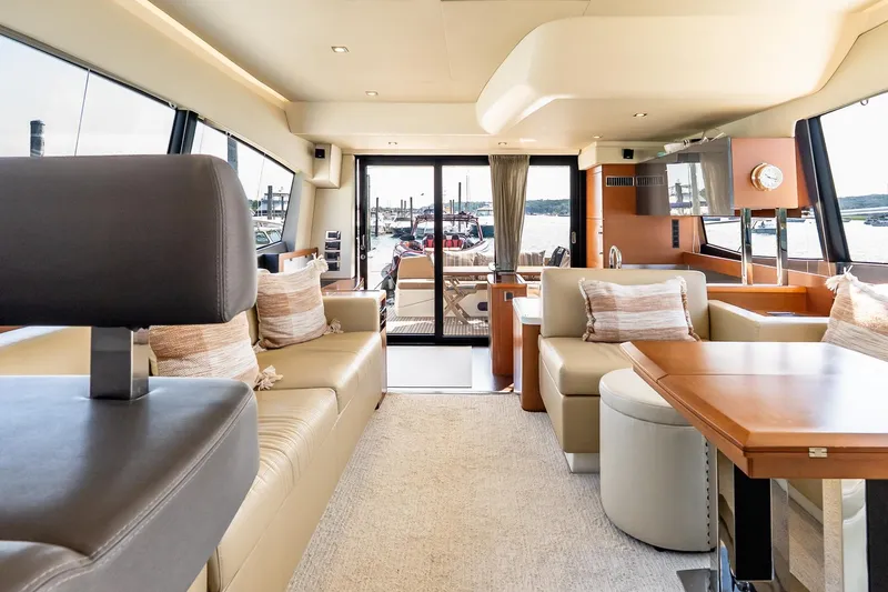 Slide: The Image of Luxurious interior of 2014 Prestige Yachts 550 Flybridge with elegant seating and panoramic windows. - 45