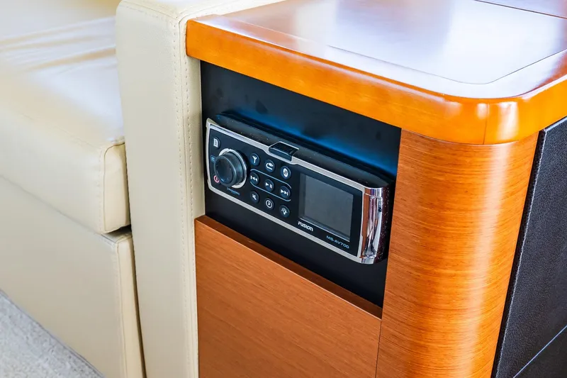 Slide: The Image of Control panel on 2014 Prestige Yachts 550 Flybridge, featuring sleek wood and leather design. - 52