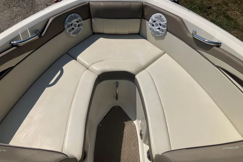 Slide: The Image of Interior seating of 2013 Sea Ray 210 SLX boat with speakers and handles. - 24