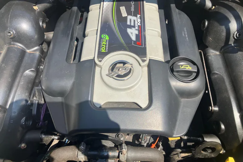 Slide: The Image of Engine of a 2013 Sea Ray 210 SLX boat, featuring a 4.3 MPI motor. - 30