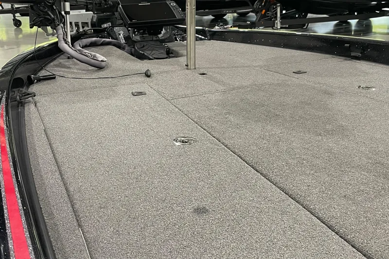 Slide: The Image of 2021 Phoenix 21 PHX boat deck with carpeted surface and equipment. - 5