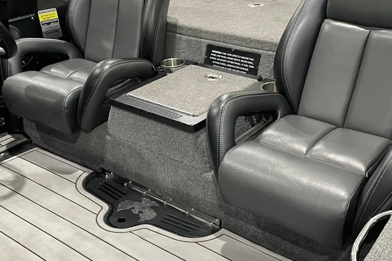Slide: The Image of 2021 Phoenix 21 PHX boat interior with gray leather seats and center console. - 6