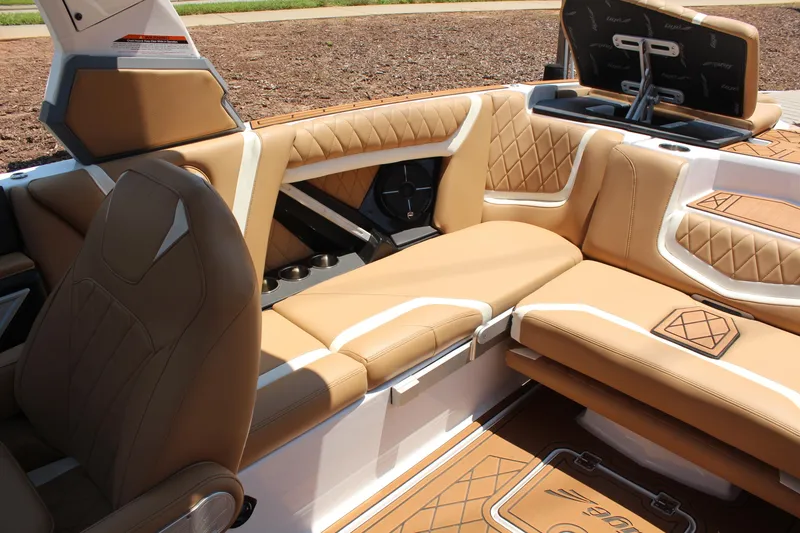 Slide: The Image of Luxurious interior of 2021 Tigé 23ZX boat with tan leather seating and stylish design. - 10