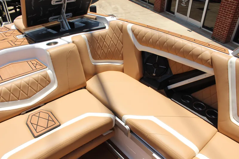 Slide: The Image of 2021 Tigé 23ZX boat interior with tan leather seating and modern design. - 11