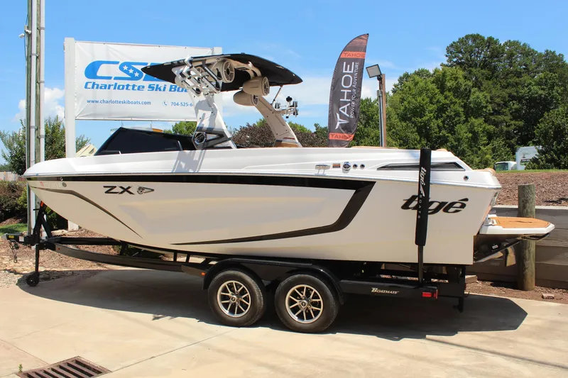 Slide: The Image of 2021 Tigé 23ZX boat on trailer at Charlotte Ski Boats dealership. - 3