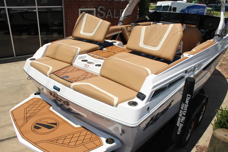 Slide: The Image of 2021 Tigé 23ZX boat with tan seating and stylish deck design. - 8