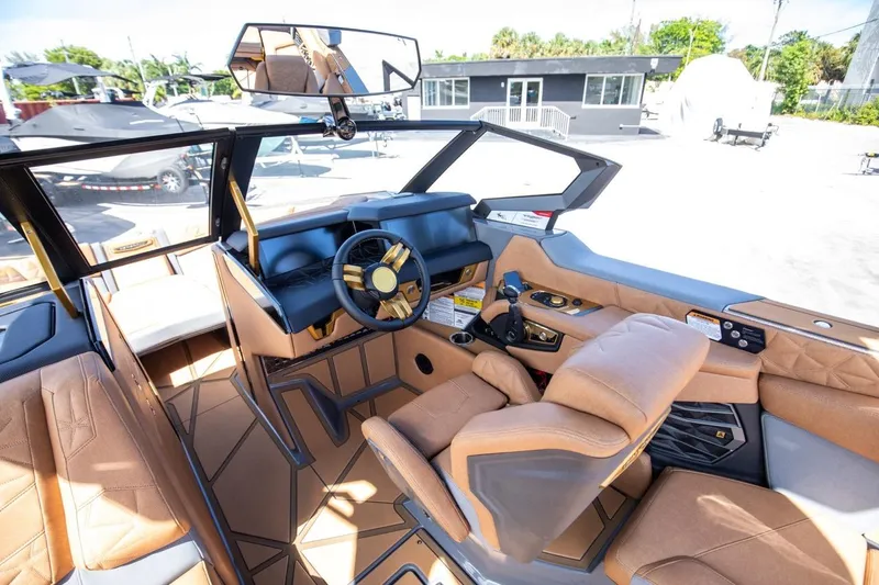 Slide: The Image of 2024 Nautique Super Air Nautique G23 Paragon interior with luxurious seating and modern dashboard. - 21