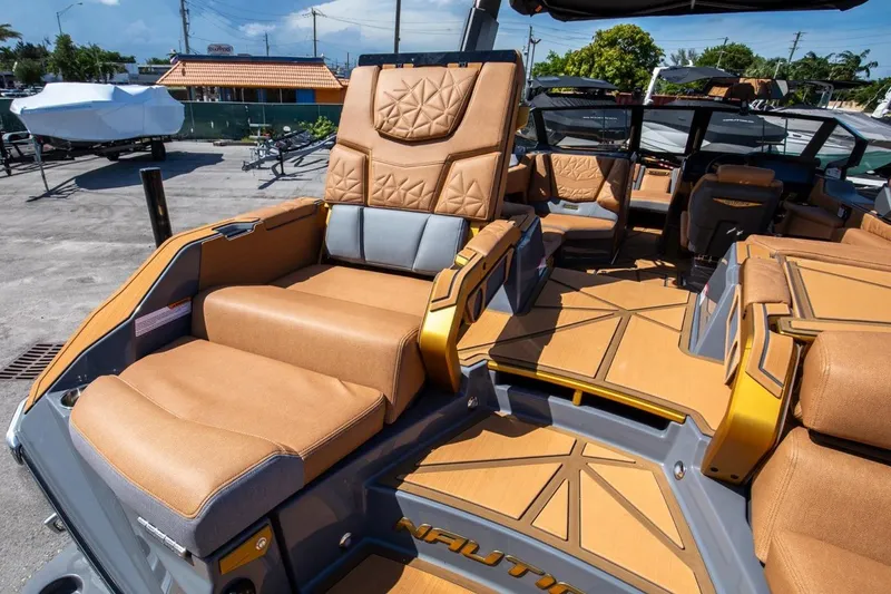 Slide: The Image of 2024 Nautique Super Air Nautique G23 Paragon interior with luxurious tan seating and modern design. - 28