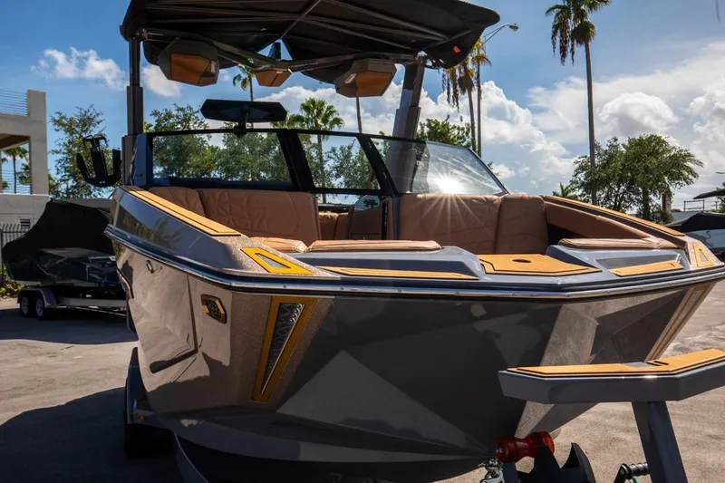 Slide: The Image of 2024 Nautique Super Air Nautique G23 Paragon boat, sleek design, parked outdoors. - 30
