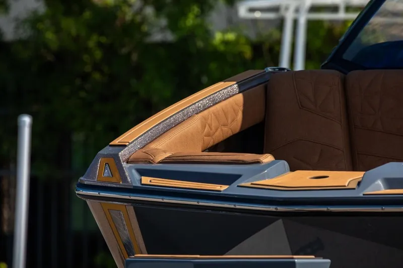 Slide: The Image of 2024 Nautique Super Air Nautique G23 Paragon, luxurious interior detail, brown upholstery. - 32