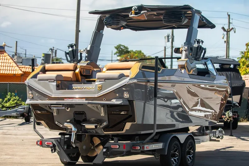 Slide: The Image of 2024 Nautique Super Air Nautique G23 Paragon boat on trailer, rear view. - 38