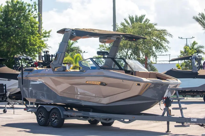 Slide: The Image of 2024 Nautique Super Air Nautique G23 Paragon boat on trailer, parked outdoors. - 46