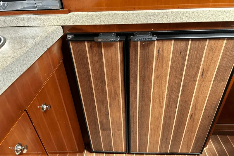 Slide: The Image of Wood-paneled fridge in 2005 Regal Commodore 4260 yacht kitchen. - 18