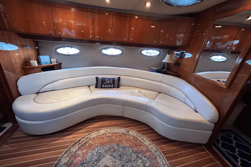 Slide: The Image of Luxurious interior of 2005 Regal Commodore 4260 yacht with curved leather seating. - 20