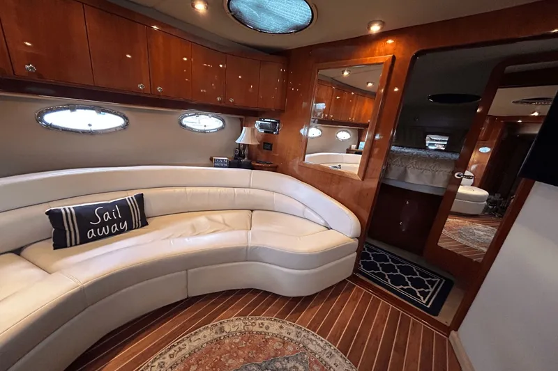 Slide: The Image of Luxurious interior of 2005 Regal Commodore 4260 yacht with plush seating and elegant wood finishes. - 21