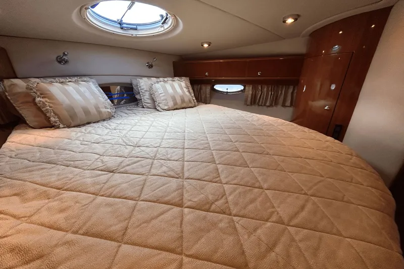 Slide: The Image of Luxurious cabin interior of 2005 Regal Commodore 4260 yacht with plush bedding. - 24