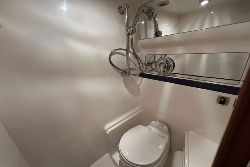 Slide: The Image of Bathroom interior of 2005 Regal Commodore 4260 yacht, featuring modern fixtures. - 32