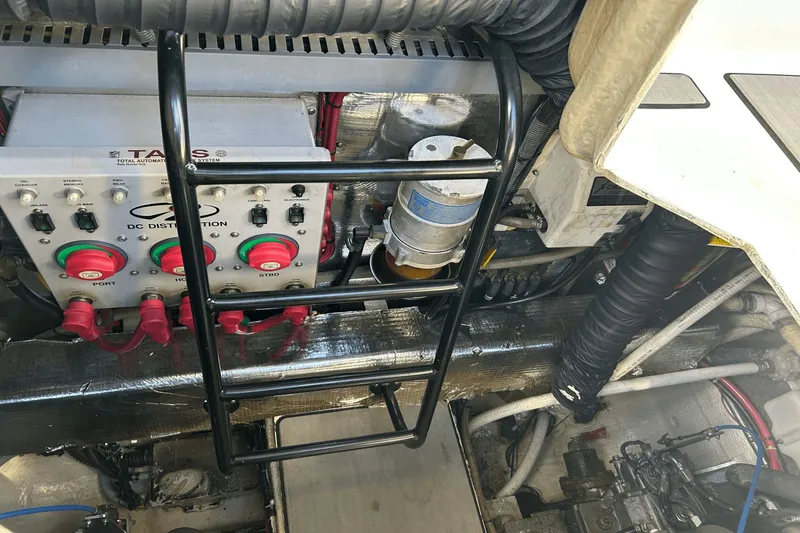 Slide: The Image of Engine room of a 2005 Regal Commodore 4260 with control panel and wiring. - 38