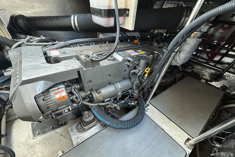 Slide: The Image of Engine compartment of a 2005 Regal Commodore 4260 boat, showcasing detailed machinery. - 40