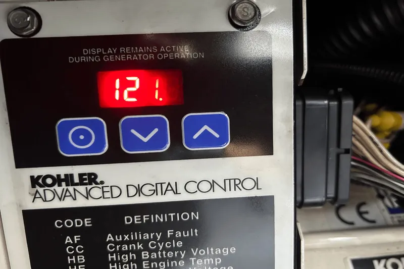 Slide: The Image of Kohler advanced digital control panel displaying "121" on a Regal Commodore 4260, 2005 model. - 43