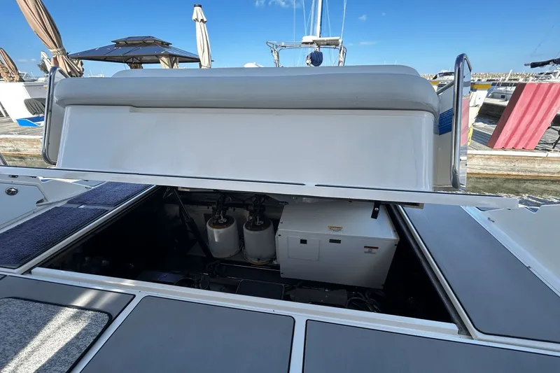 Slide: The Image of 2005 Regal Commodore 4260 yacht engine compartment open at marina. - 45