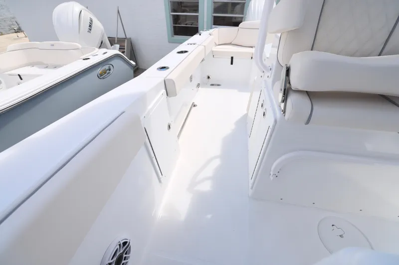 Slide: The Image of 2026 Sea Hunt Ultra 275 SE boat interior with seating and dual Yamaha engines. - 11