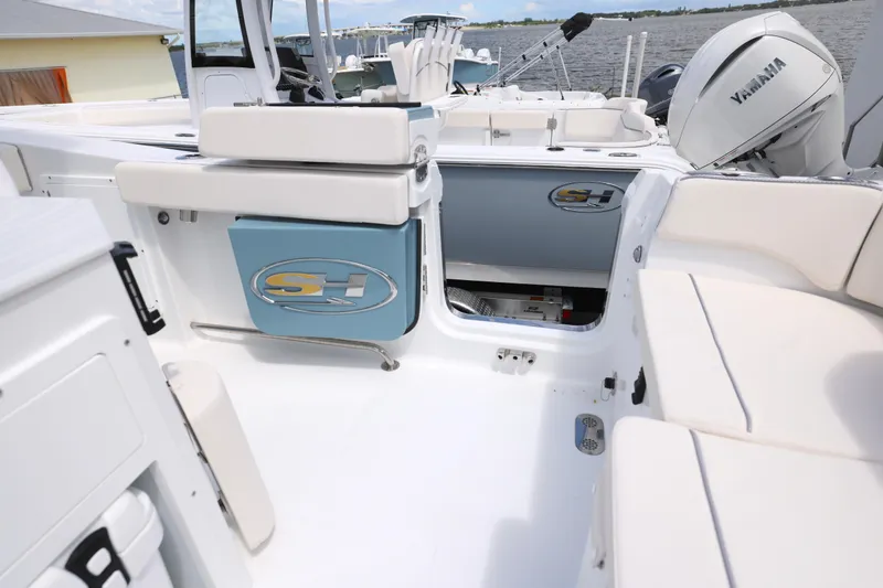 Slide: The Image of 2026 Sea Hunt Ultra 275 SE boat interior with white seating and sleek design. - 16