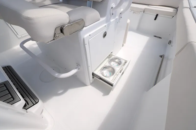 Slide: The Image of 2026 Sea Hunt Ultra 275 SE boat interior with Yamaha engine, featuring seating and storage. - 19