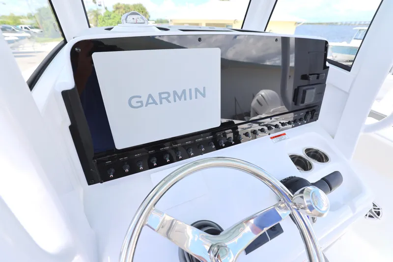 Slide: The Image of Interior of 2026 Sea Hunt Ultra 275 SE boat bathroom with toilet and storage. - 24