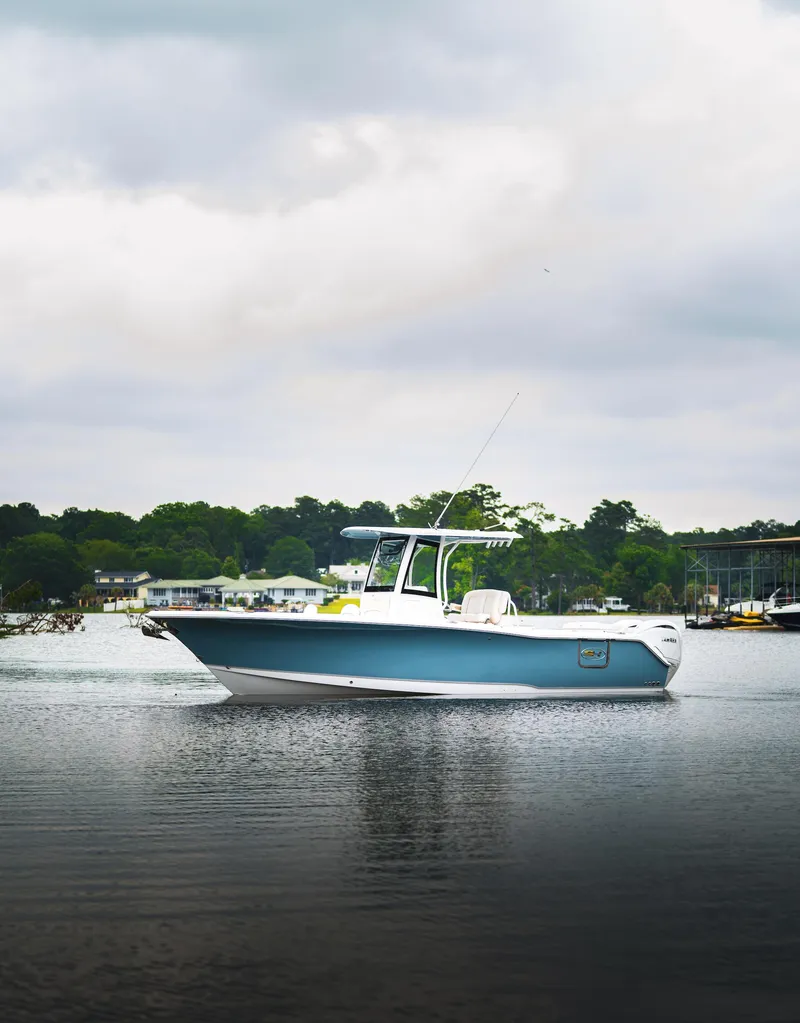 Slide: The Image of 2026 Sea Hunt Ultra 275 SE boat interior with white seating and spacious layout. - 29