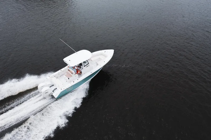 Slide: The Image of Aerial view of 2026 Sea Hunt Ultra 275 SE boat docked at a pier. - 32