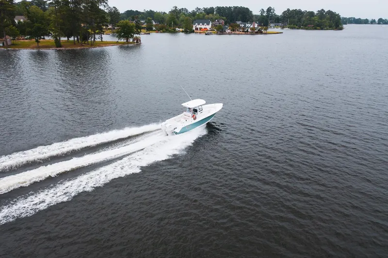 Slide: The Image of 2026 Sea Hunt Ultra 275 SE boat cruising on open water. - 34
