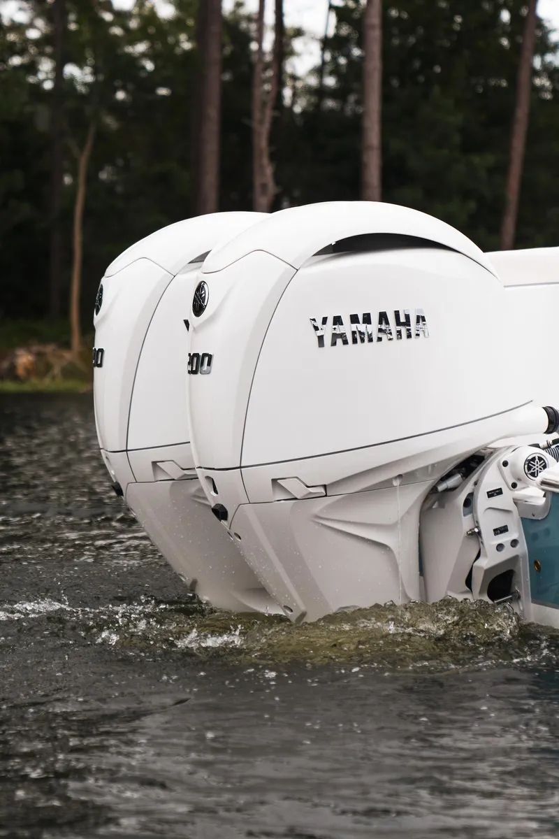 Slide: The Image of 2026 Sea Hunt Ultra 275 SE boat cruising on a lake with two passengers. - 35