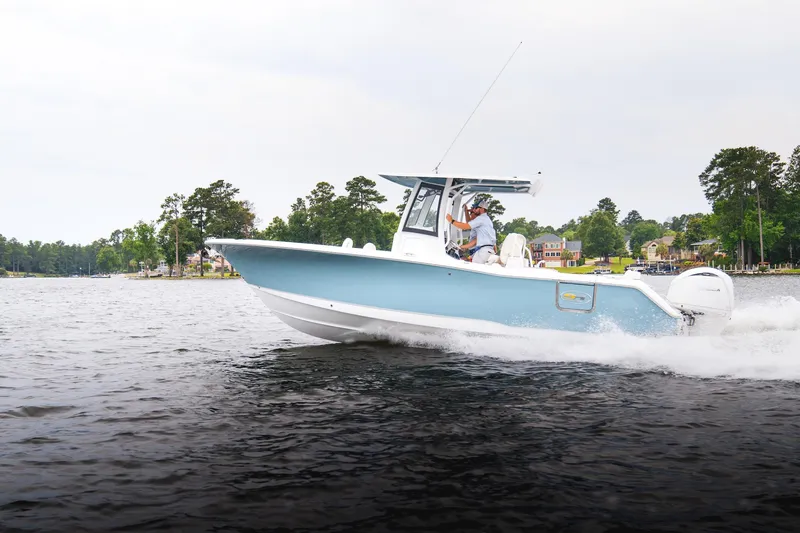 Slide: The Image of Aerial view of 2026 Sea Hunt Ultra 275 SE boat cruising on open water. - 41