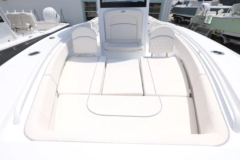 Slide: The Image of 2026 Sea Hunt Ultra 275 SE boat interior with white seating and sleek design. - 8