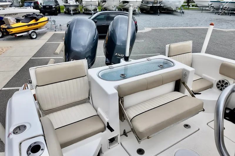 Slide: The Image of 2018 Sea Fox 266 Commander boat interior with seating and dual engines. - 10