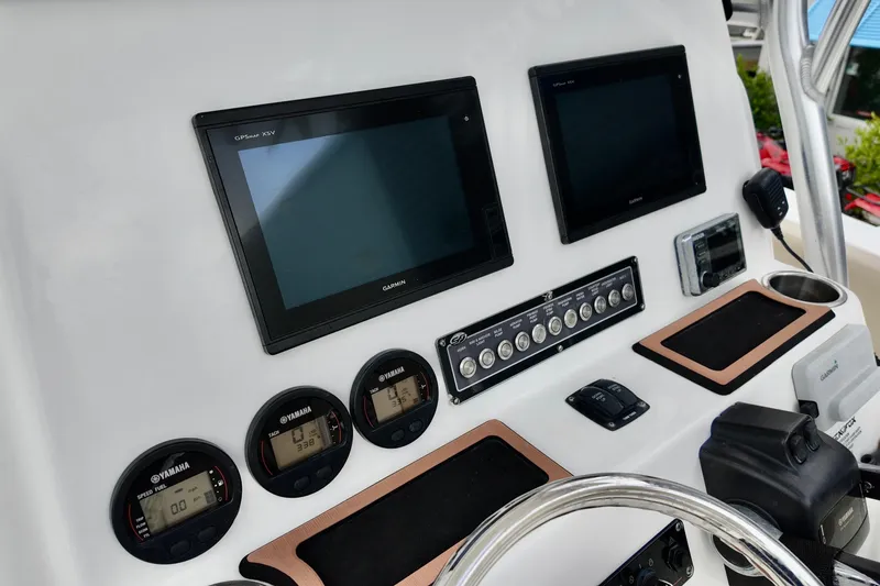 Slide: The Image of 2018 Sea Fox 266 Commander dashboard with Garmin displays and Yamaha gauges. - 16