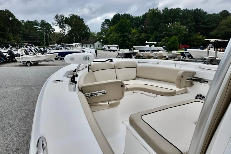 Slide: The Image of 2018 Sea Fox 266 Commander boat with spacious seating, displayed outdoors. - 22