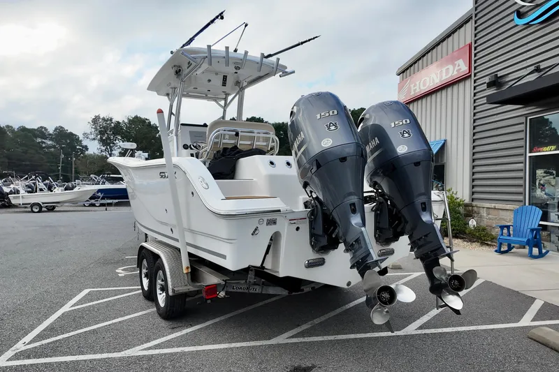 Slide: The Image of 2018 Sea Fox 266 Commander boat with dual Yamaha 150 engines on a trailer. - 3