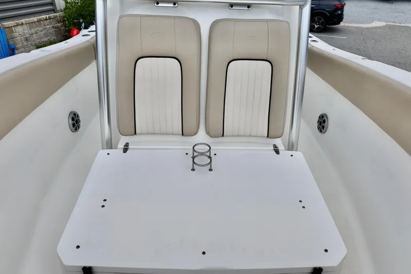 Slide: The Image of 2018 Sea Fox 266 Commander boat interior with beige seating and white table. - 8