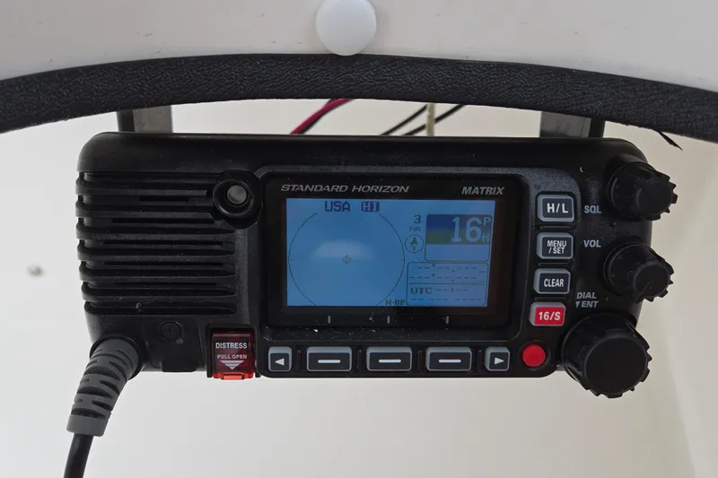 Slide: The Image of Standard Horizon Matrix radio on 2020 Twin Vee 240 DC GF boat dashboard. - 11