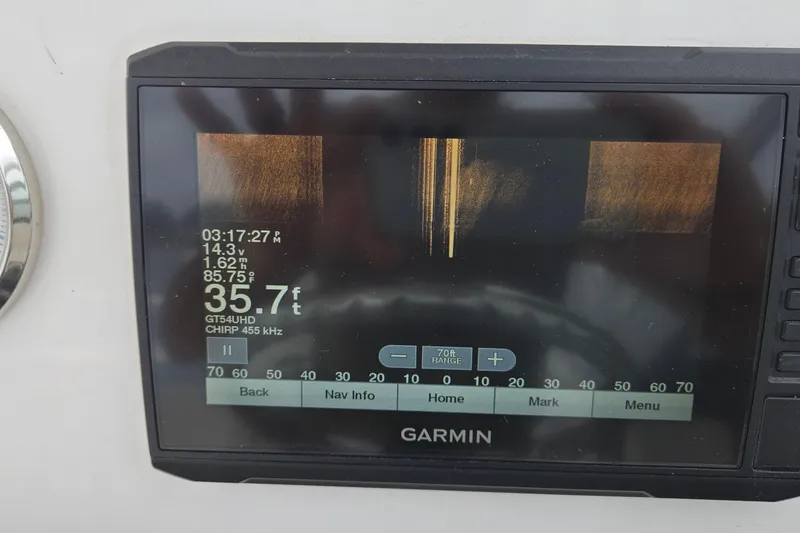 Slide: The Image of Garmin sonar display on 2020 Twin Vee 240 DC GF boat, showing depth and temperature. - 13