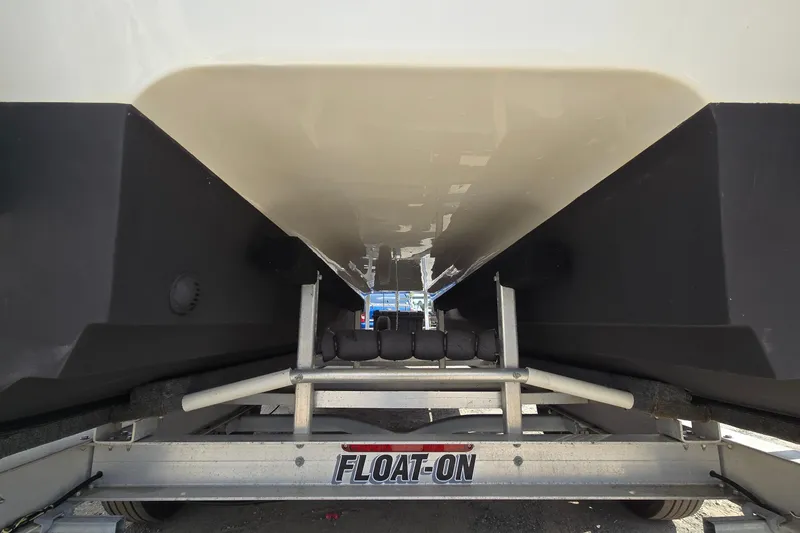 Slide: The Image of Underneath view of 2020 Twin Vee 240 DC GF boat on a trailer. - 16
