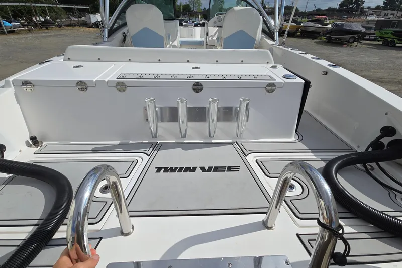 Slide: The Image of 2020 Twin Vee 240 DC GF boat interior with seating and storage features. - 20