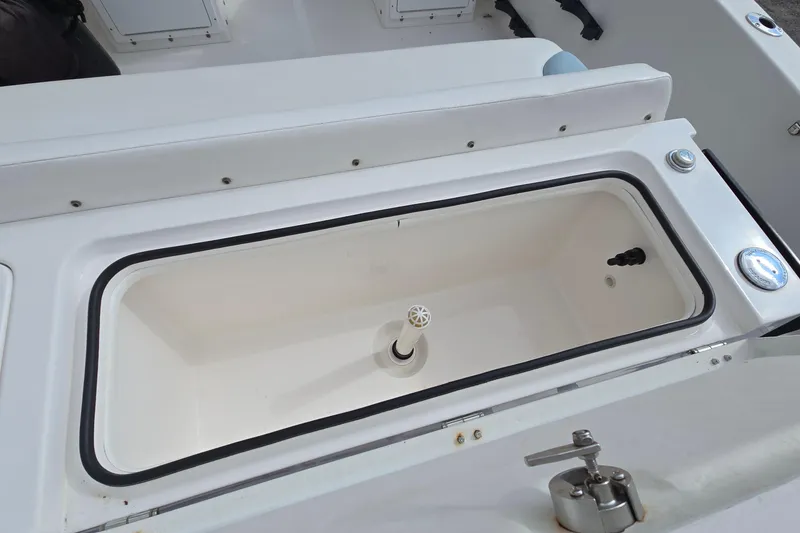 Slide: The Image of 2020 Twin Vee 240 DC GF boat interior with open storage compartment. - 28