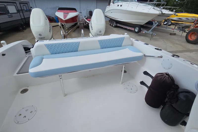 Slide: The Image of 2020 Twin Vee 240 DC GF boat interior with seating and dual outboard engines. - 33