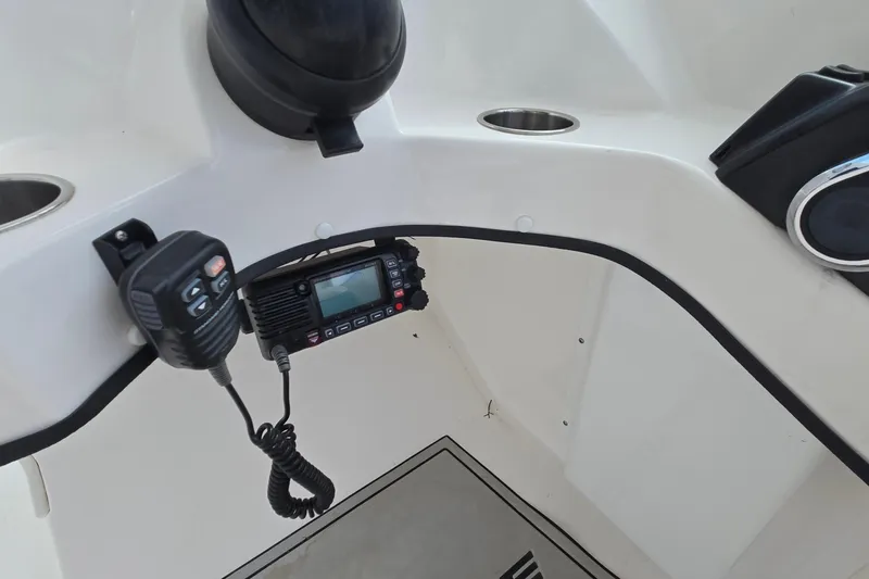 Slide: The Image of Interior of 2020 Twin Vee 240 DC GF boat with radio and speaker system. - 36