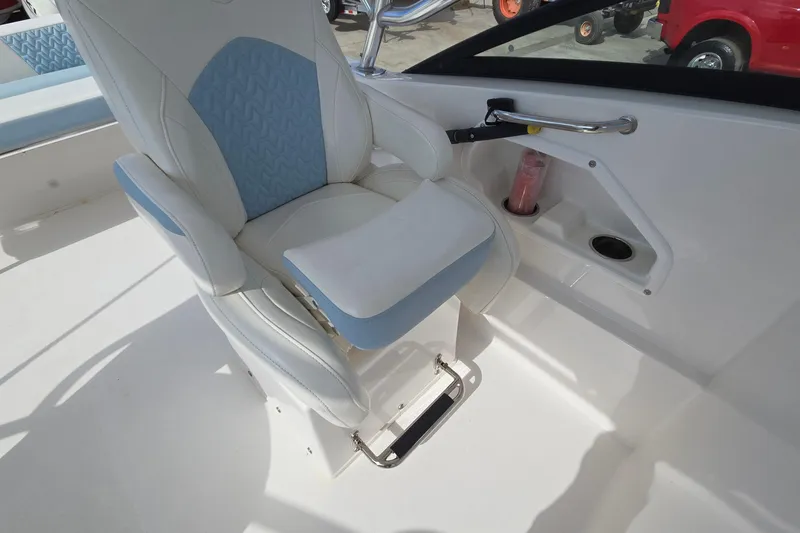 Slide: The Image of Captain's chair on 2020 Twin Vee 240 DC GF boat, featuring white and blue upholstery. - 43