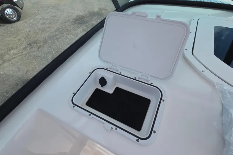Slide: The Image of Open storage compartment on 2020 Twin Vee 240 DC GF boat deck. - 45